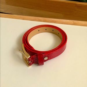 Red belt with metal buckle